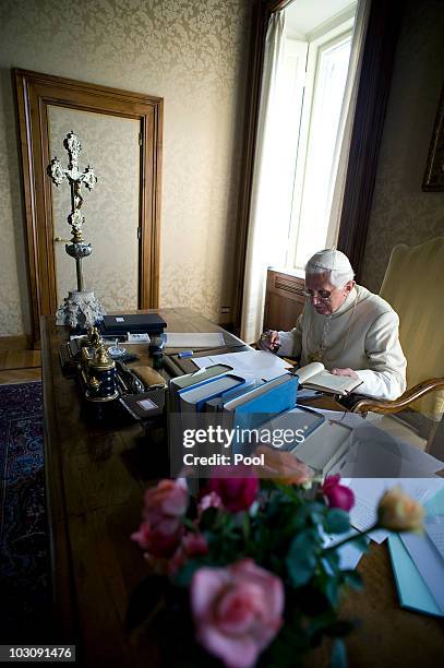 Pope Benedict XVI reads in his summer residence on July 26, 2010 in Castel Gandolfo, near Rome, Italy. The Pontiff will visit England from September...