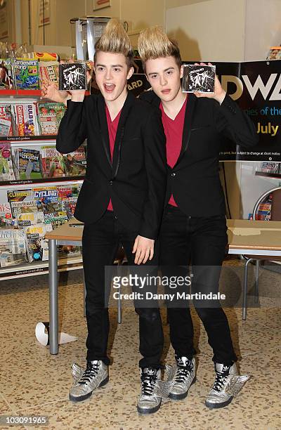 John Grimes and Edward Grimes of Jedward attend a photocall ahead of meeting fans and signing copies of their album 'Planet Jedward' on July 26, 2010...