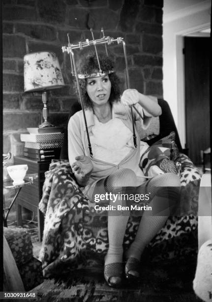 Judy Carne comedienne and actress, who suffered a broken neck in a car accident, wearing a 'halo brace' at her girlhood home Chapel Brampton,...