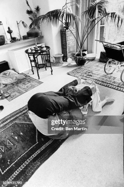 Ronald David Laing Scottish psychiatrist playing with daughter Natasha in the parlor of their basement flat in Hampstead, March 4th 1976.