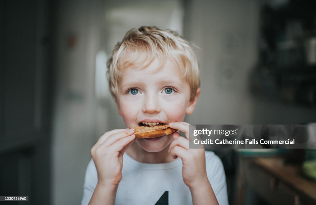 Kid eating a bagel