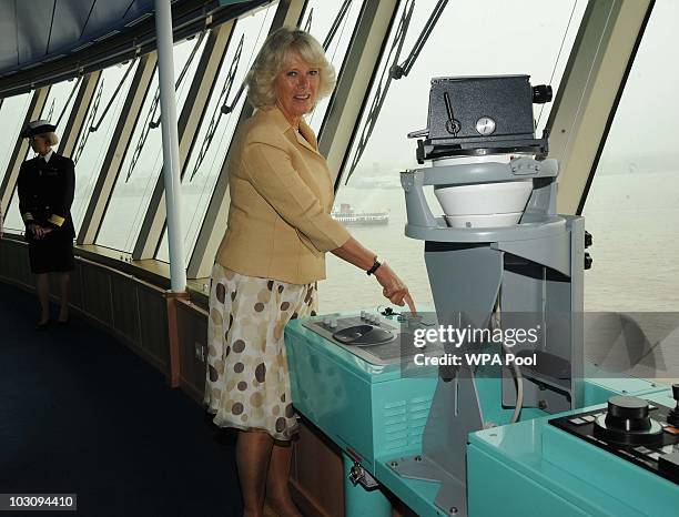 Camilla, Duchess Of Cornwall sounds the noon whistle on board the Cunard Liner 'Queen Victoria while on her visit to Merseyside on July 26th in...