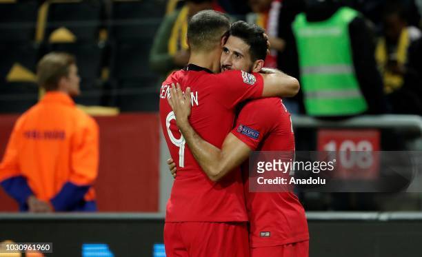Emre Akbaba of Turkey celebrates with his team mate Cenk Tosun of Turkey after scoring a goal during the UEFA Nations League, Group 2 of League B...