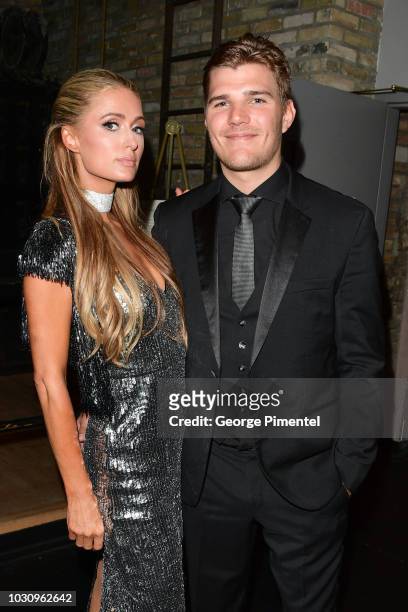 Paris Hilton and Chris Zylka attend the "The Death And Life Of John F. Donovan" premiere during 2018 Toronto International Film Festival at Winter...