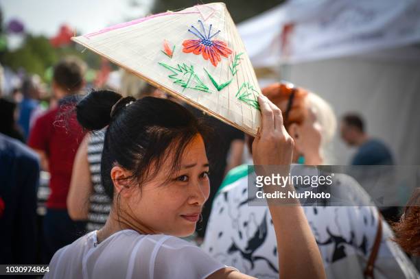 Woman with a rice hat is seen at the Vietnam Culture Festival in Warsaw, Poland on September 2, 2018.