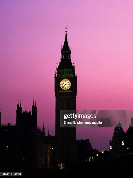 big ben and the iconic london landmark at twilight - big ben night stock pictures, royalty-free photos & images