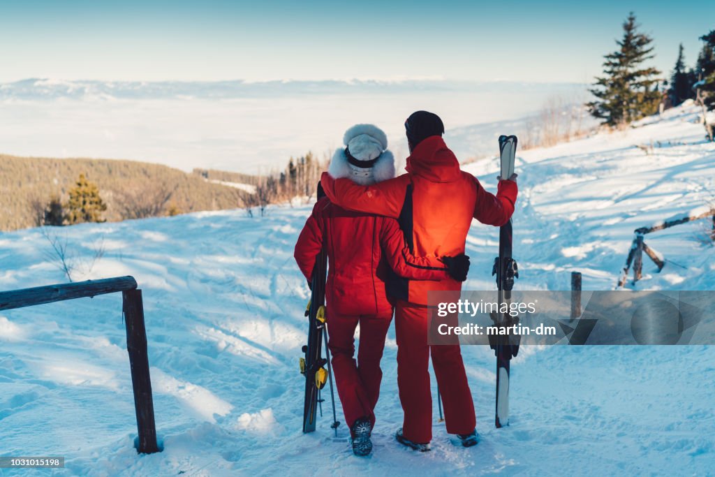 Couple on ski holiday enjoying the sunshine