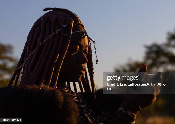 Himba tribe woman face in the sun, Cunene Province, Oncocua, Angola on July 13, 2018 in Oncocua, Angola.