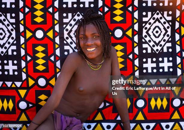 Smiling batwa tribe young woman who will soon be married, Cunene Province, Oncocua, Angola on July 14, 2018 in Oncocua, Angola.