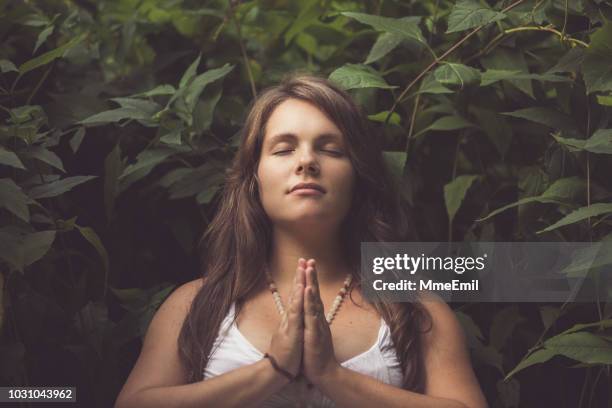 young mother to be practicing prenatal yoga outdoors - new age stock pictures, royalty-free photos & images