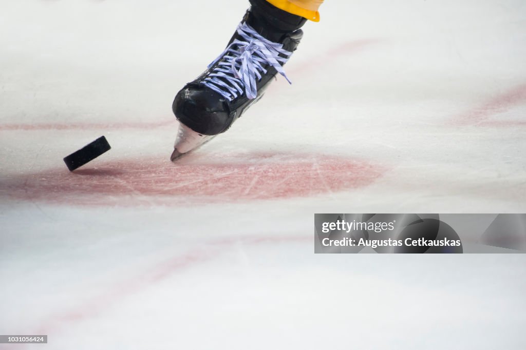 Low Section Of Person Playing Ice Hokey In Rink