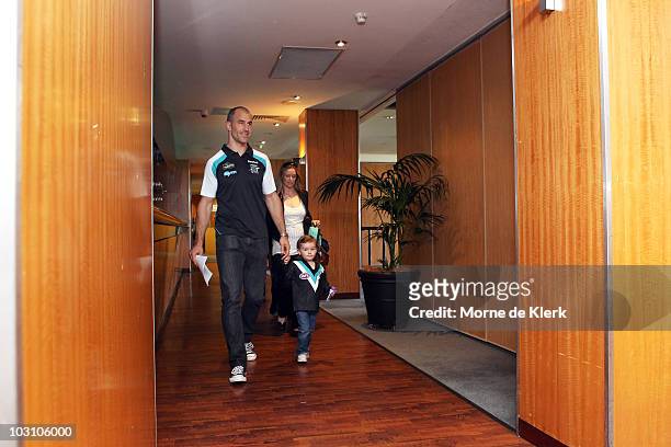 Warren Tredrea of the Port Adelaide Power arrives at a media conference with his family to announce his AFL retirement at the Port Adelaide...