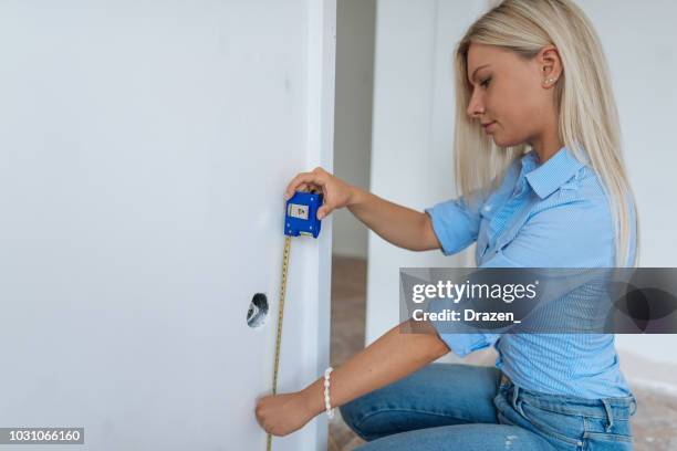 female engineer working on the construction site - meter instrument of measurement stock pictures, royalty-free photos & images