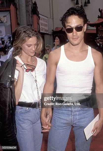 Actor Brandon Lee and girlfriend Eliza Hutton attend the "Little Man Tate" Hollywood Premiere on October 6, 1991 at Mann's Chinese Theatre in...