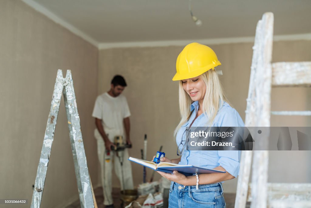 Building Inspecotor Female Building Inspector On Construction Site High-Res Stock Photo ...