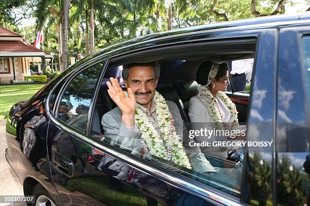 Saudi Prince Al-Waleed bin Talal and his wife Princess Amira al-Taweel leave after a meeting with President of French Polynesia Gaston Tong Sang on...