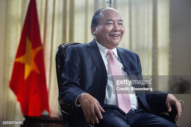 Nguyen Xuan Phuc, Vietnam's prime minister, laughs during a Bloomberg Television interview in Hanoi, Vietnam, on Monday, Sept. 10, 2018....