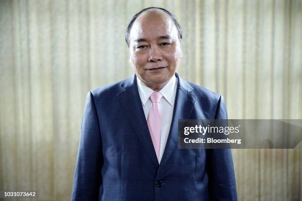 Nguyen Xuan Phuc, Vietnam's prime minister, poses for a photograph following a Bloomberg Television interview in Hanoi, Vietnam, on Monday, Sept. 10,...