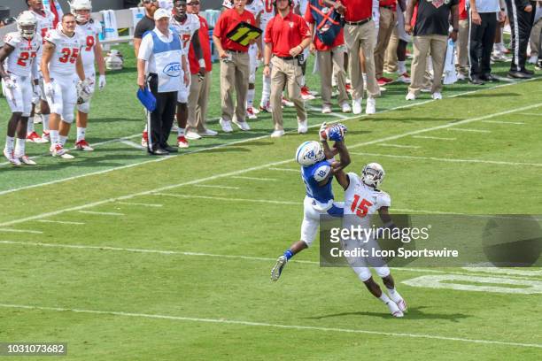 Georgia State Panthers wide receiver Penny Hart leaps for the reception as North Carolina State Wolfpack cornerback Chris Ingram defends during the...