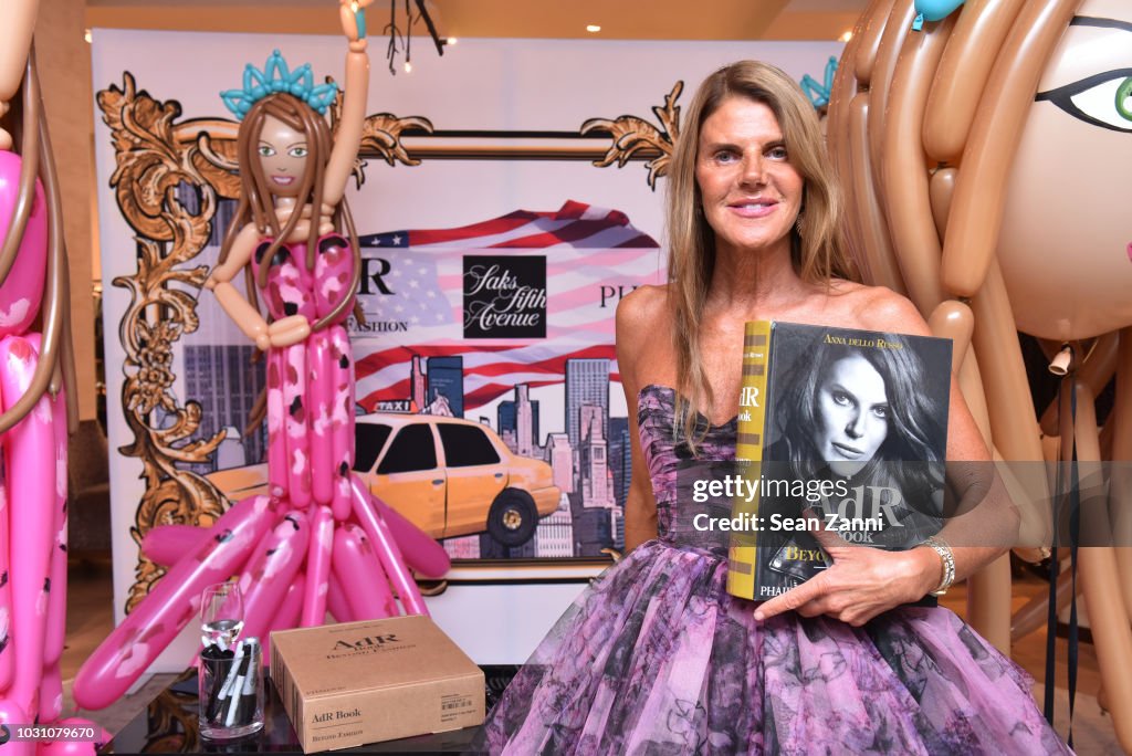 Author & Fashion Journalist Anna Dello Russo poses with her book as