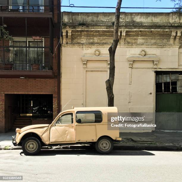 old car parked in the street - citroen deux chevaux stock pictures, royalty-free photos & images