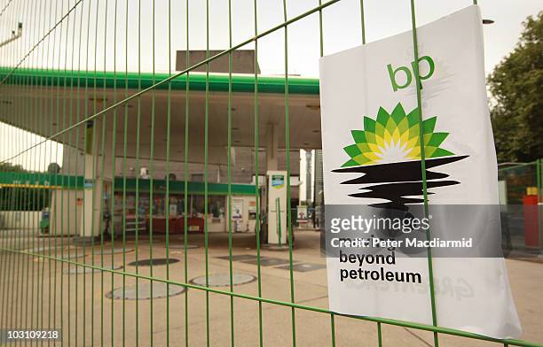 Greenpeace poster displaying a leaking oil logo is placed on a fence after activists closed a BP petrol station in Camden on July 27, 2010 in London,...