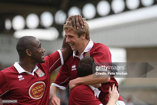 Michael Jacobs of Northampton Town celebrates with team mate Nathaniel Wedderburn after scoring his and his sides second goal during the pre season...