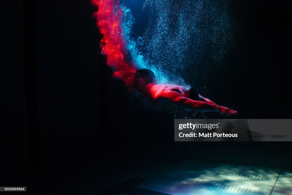 Man diving into pool