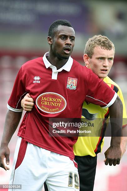 Courtney Herbert of Northampton Town and Lee Hodson of Watford in action during the pre season match between Northampton Town and Watford at...