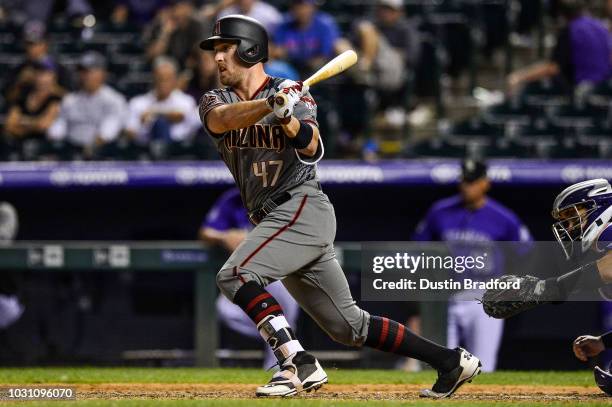 Patrick Kivlehan of the Arizona Diamondbacks singles in the eighth inning in his first plate appearance of 2018 during a game against the Colorado...