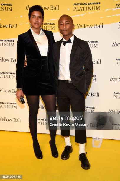 Helen Lasichanh and Pharrell Williams pose on the Yellow carpet at the Yellow Ball, hosted by American Express and Pharrell Williams, at the Brooklyn...