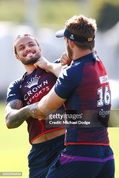Sandor Earl playfully wrestles with Christian Welch of the Storm during a Melbourne Storm NRL training session at Gosch's Paddock on September 11,...