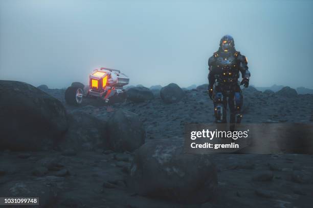 futuristic astronaut walking on alien planet - rover stock pictures, royalty-free photos & images