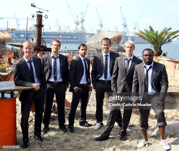 Timo Schultz , Mathias Hain , Fabio Morena , Thomas Kessler , Marius Ebbers and Gerald Asamoah pose during the FC St. Pauli street wear presentation...