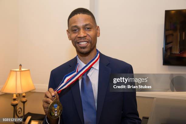 Kecalf Franklin, Son of Aretha Franklin poses with the Legacy Award he accepted on behalf of his mom during 'Evolution of Gospel - A Tribute to...
