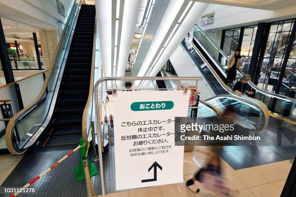 An escalator is stopped in attempt to save energy at a department store on September 10, 2018 in Sapporo, Hokkaido, Japan. Commuters hit the streets...