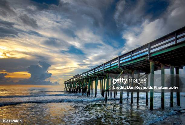 pier at sunrise with incoming tide - amelia island stock pictures, royalty-free photos & images