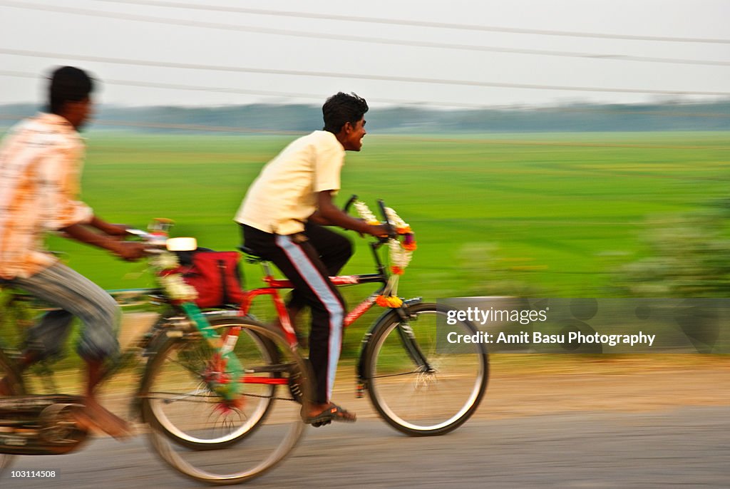 Speeding bicyclists on a village road