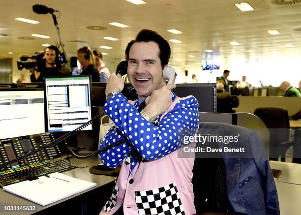 Jimmy Carr makes a trade at the BGC Charity Day at One Churchill Place on September 11, 2018 in London, England.