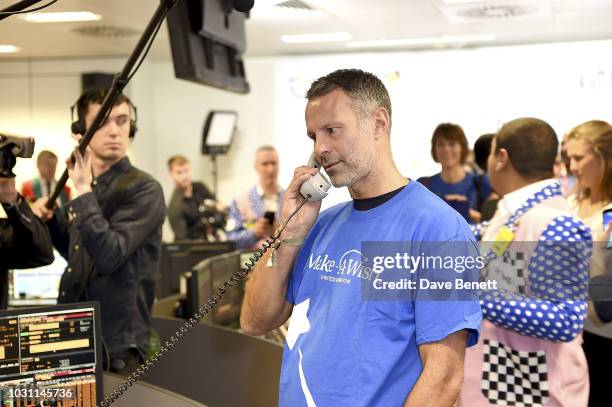 Ryan Giggs, representing Make-a-Wish foundation, makes trades during BGC Charity Day at One Churchill Place on September 11, 2018 in London, England.