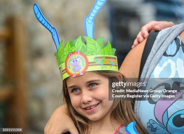 Jessica Ortiz, standing with her son, Jason Ortiz, says goodbye to Flik during the last day of operation for A Bug's Land at Disney California...