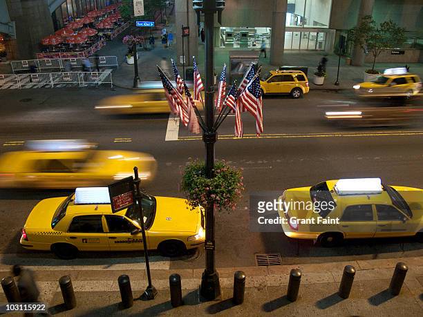 new york city street scene - yellow taxi stock pictures, royalty-free photos & images