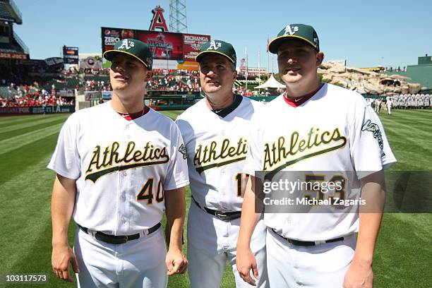 American League All-Star Trevor Cahill and Andrew Bailey of the Oakland Athletics along with Athletics manager Bob Geren stand on the field prior to...