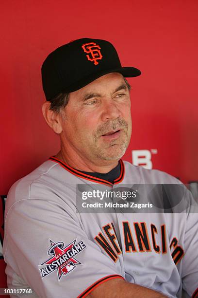 National League All-Star coach Bruce Bochy of the San Francisco Giants sitting in the dugout prior to the 81st MLB All-Star Game at Angel Stadium of...