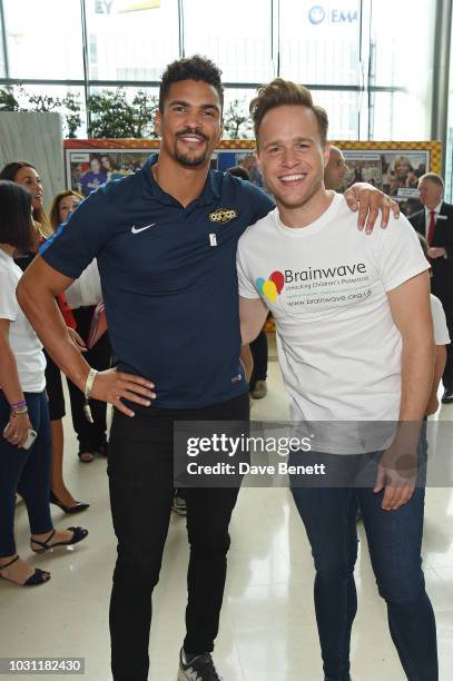 Anthony Ogogo and Olly Murs representing Brainwave attend BGC Charity Day at One Churchill Place on September 11, 2018 in London, England.