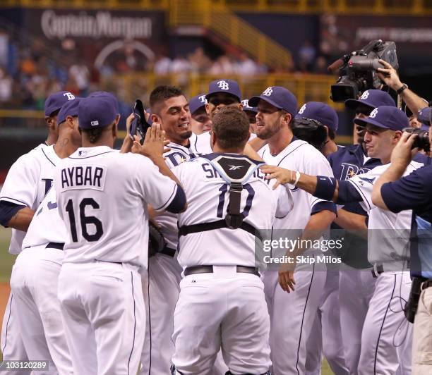 Matt Garza of the Tampa Bay Rays is surrounded by his teammates in celebration of Garza pitching a no-hitter in the Rays' 5-0 win against the Detroit...