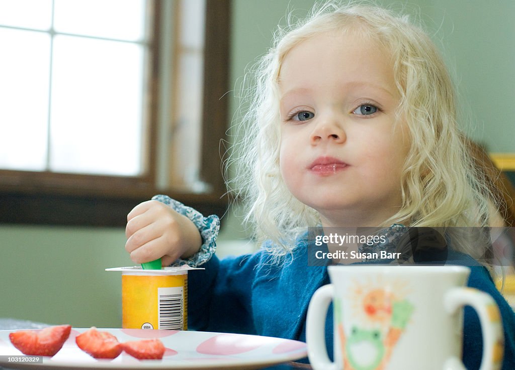 Toddler Eating at Table