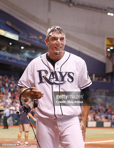 Matt Garza Evan Longoria of the Tampa Bay Rays looks on after he received a shaving cream pie to the face from teammate Evan Longoria in celebration...