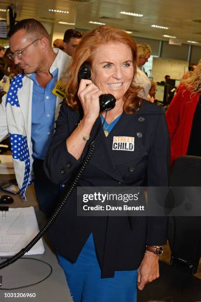 Sarah Ferguson, Duchess of York, representing Street Child, makes a trade at BGC Charity Day at One Churchill Place on September 11, 2018 in London,...