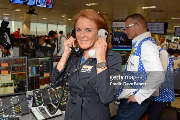 Sarah Ferguson, Duchess of York, representing Street Child, makes a trade at BGC Charity Day at One Churchill Place on September 11, 2018 in London,...